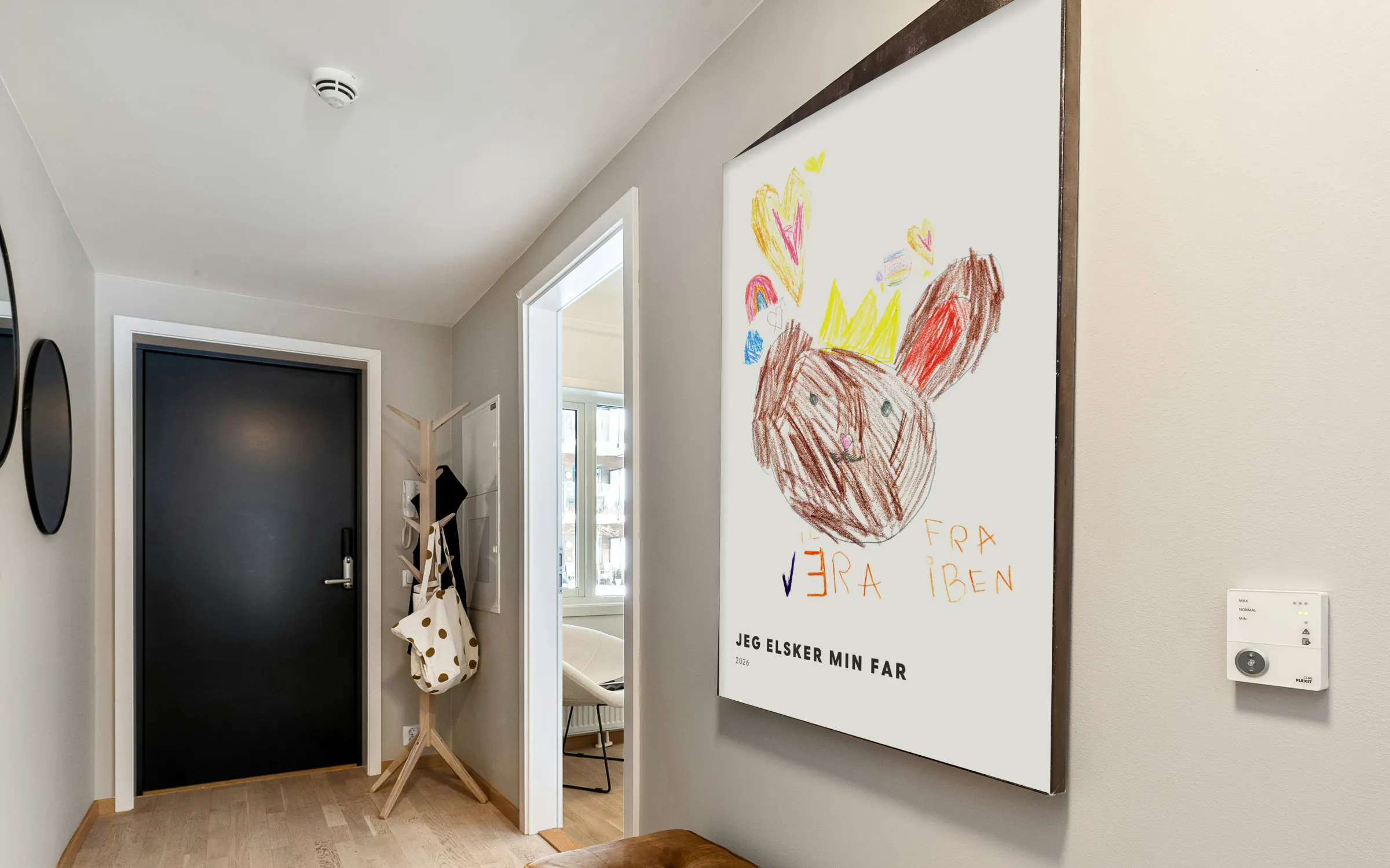 Posters of children's drawings on the wall of a hallway